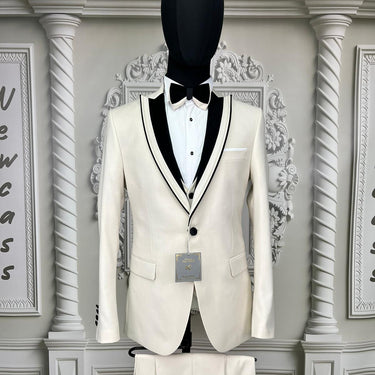 Single Button Three Pieces Tuxedo Suit with contrasting green velvet Lapel, matching bow tie and Black Pants.